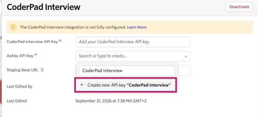 CoderPad Interview integration settings in Ashby with the Ashby API Key dropdown open and the option to create a new API key named “CoderPad Interview” highlighted.