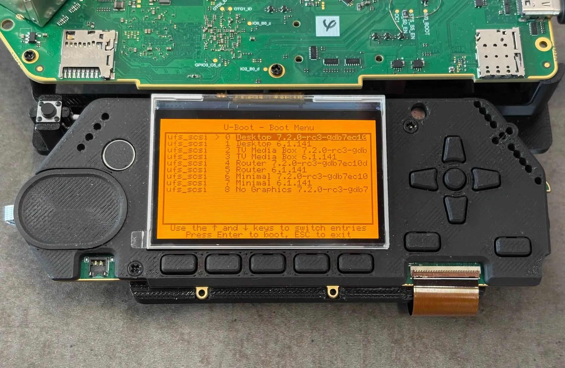 Boot menu displays available OS profiles: Desktop, TV Media Box, Router, and others